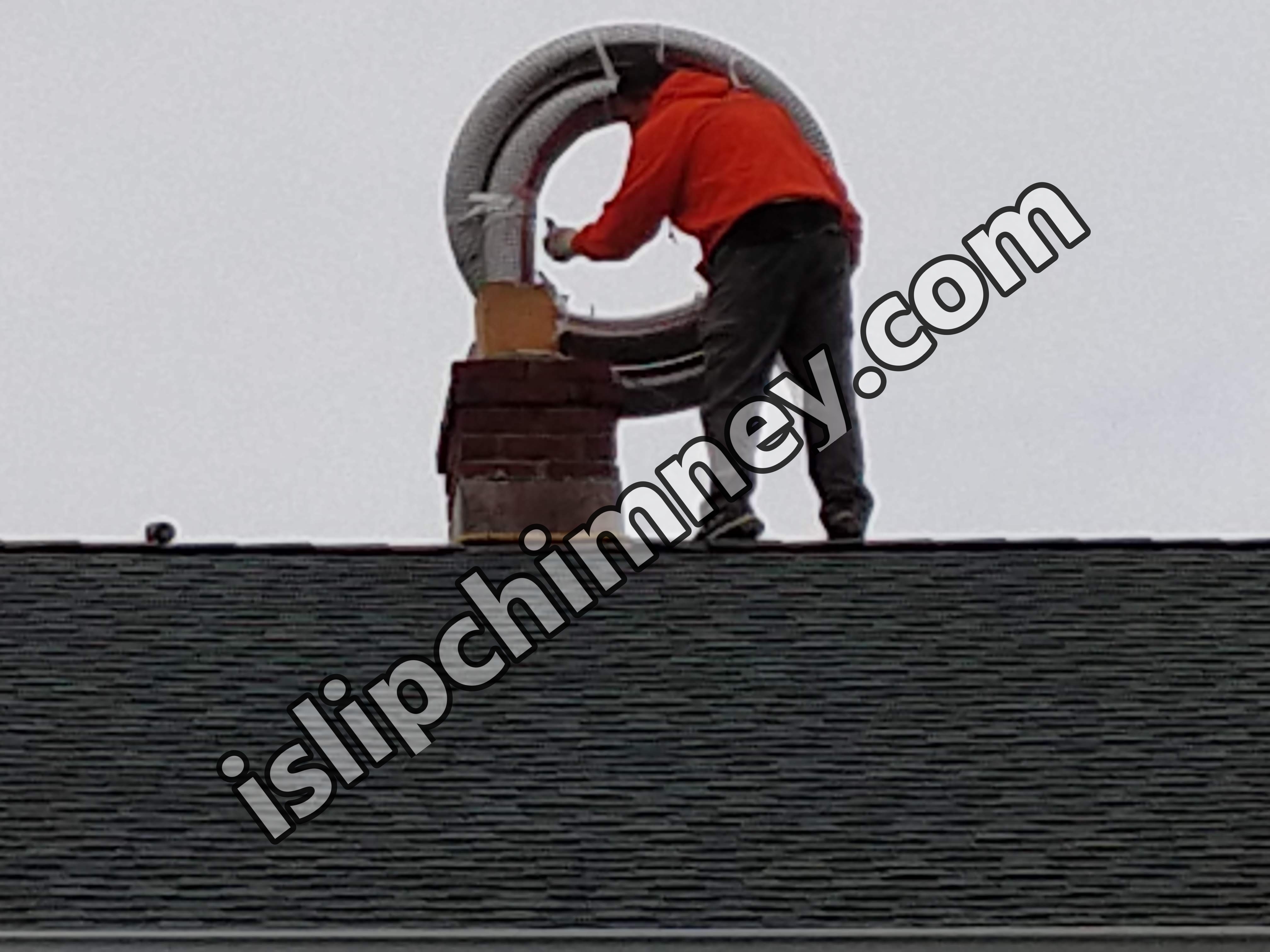 Flexible stainless chimney liner being installed in Islip, New York